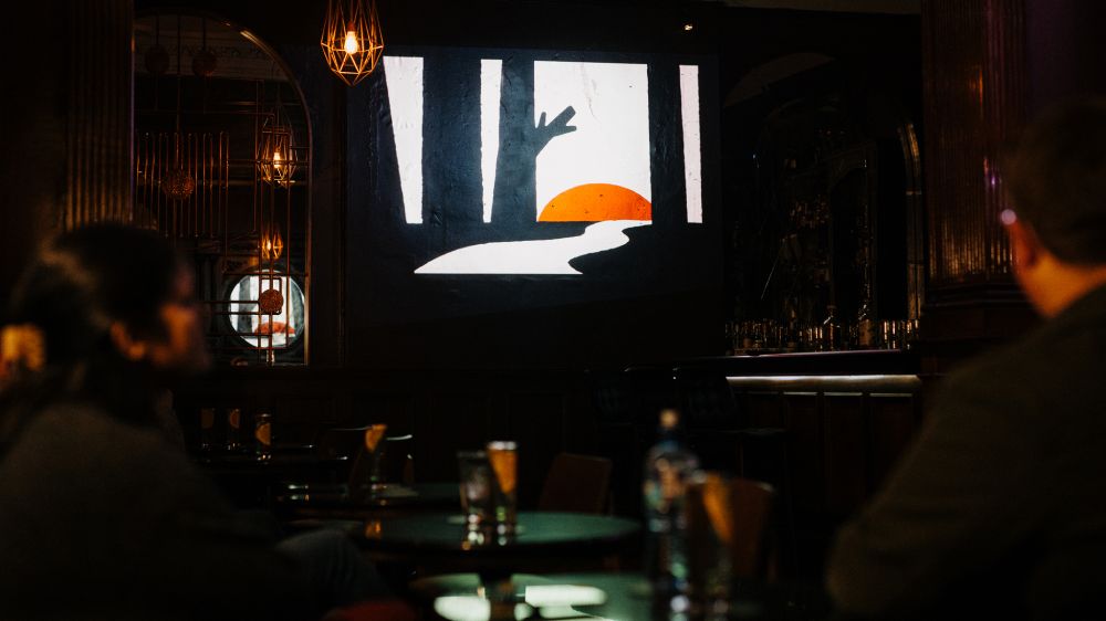 Belfast By The Glass animated projection on the wall of the main room at The Spirit Circle